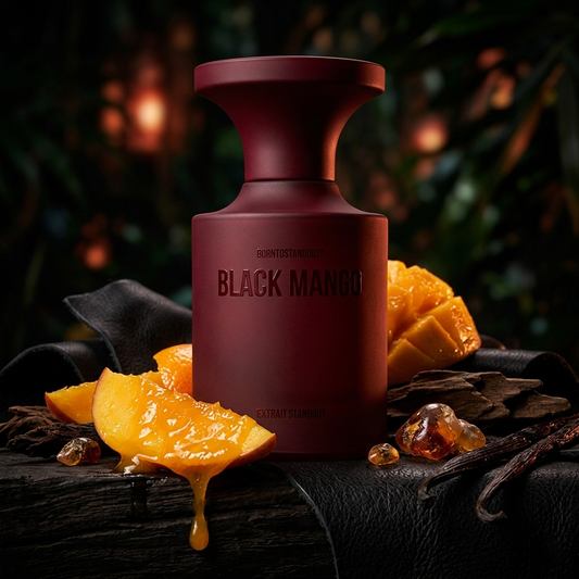 Frasco borgoña mate de BORNTOSTANDOUT Black Mango sobre madera oscura con mango maduro, oud, cuero y vainilla, estilo Casa Flores.